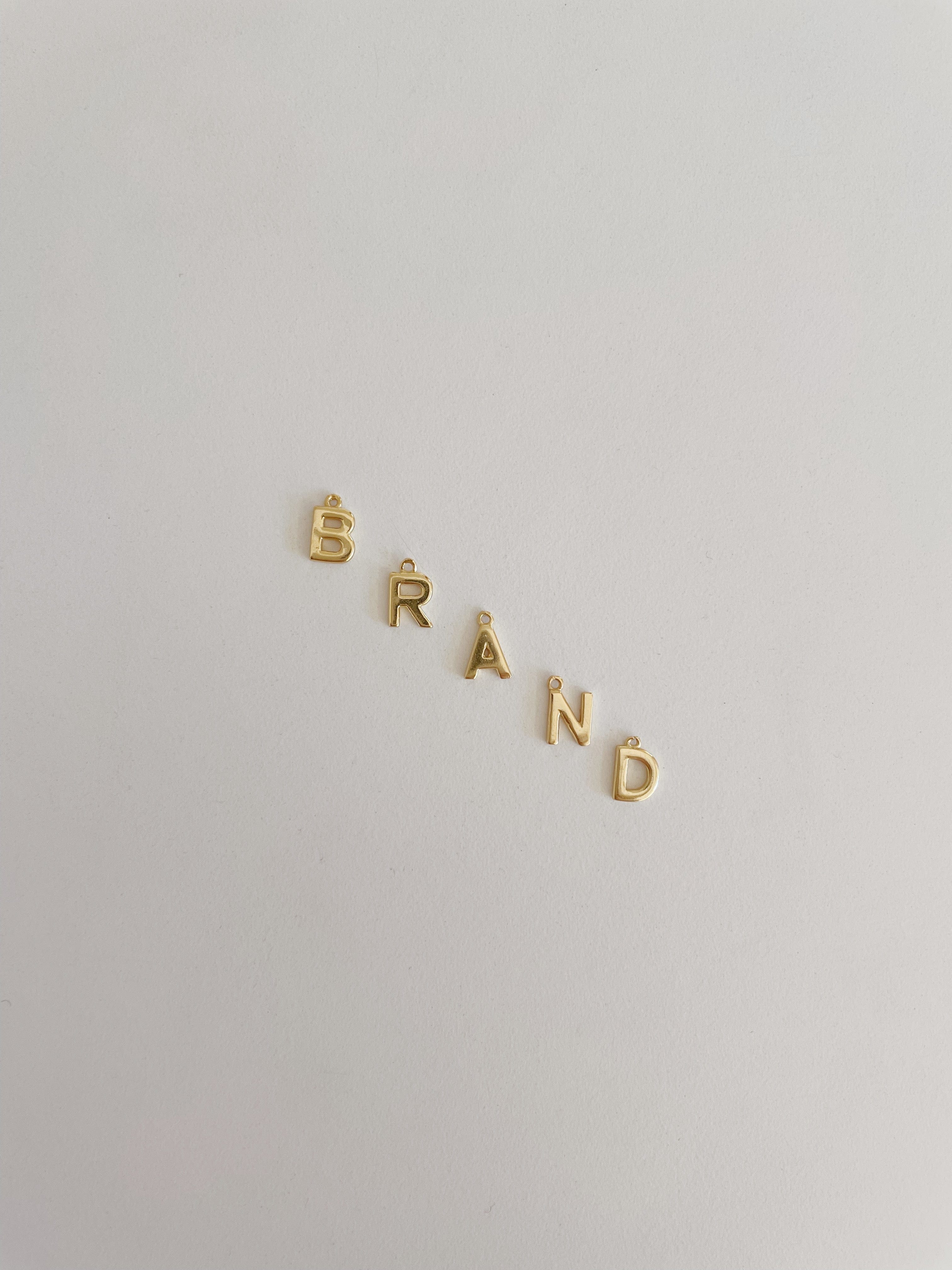INITIAL CZ CHARM - GOLD